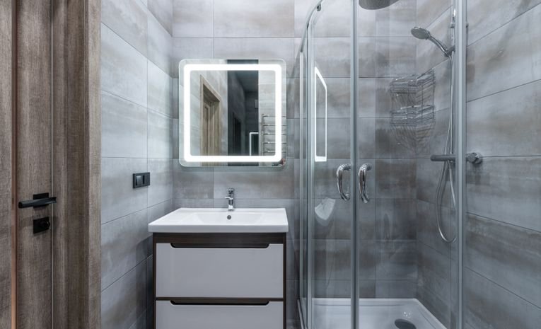 Modern bathroom with glass shower cabin