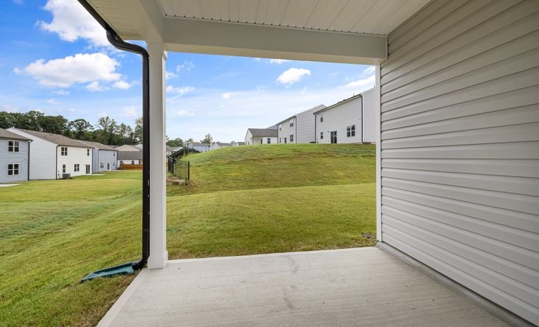 Concrete patio slabs outside a suburban house